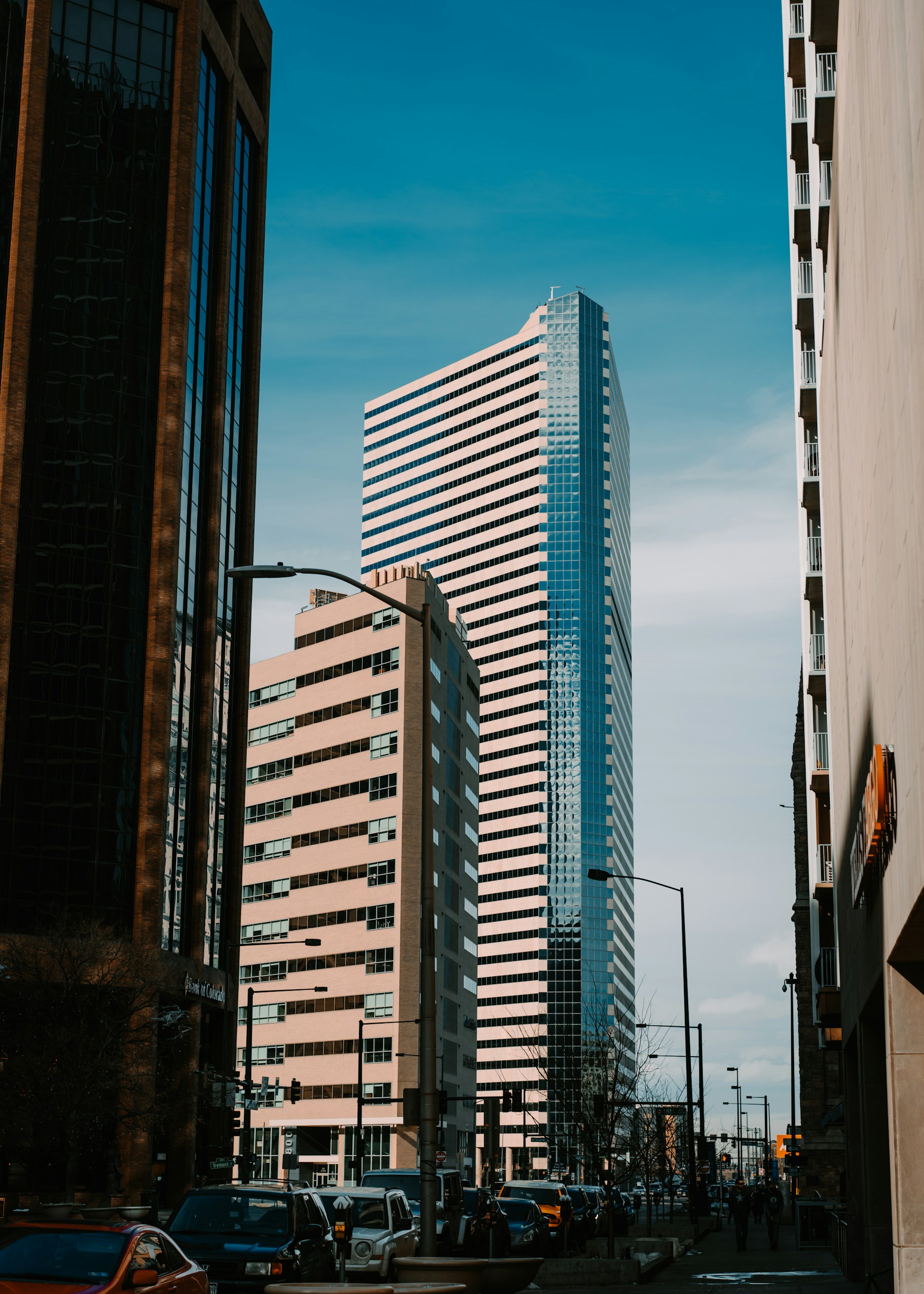 Downtown Denver skyscrapers framed between buildings